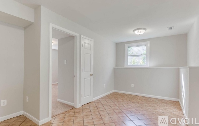A room with a door and a window.