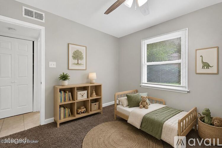 A bedroom with a bed, a window, a bookshelf, and a rug.