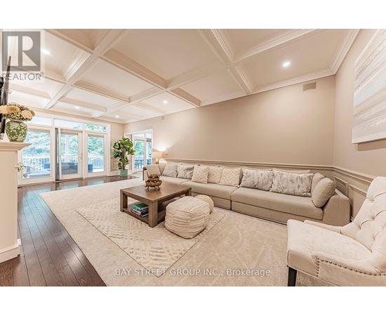 A spacious living room with a large couch and a coffee table.