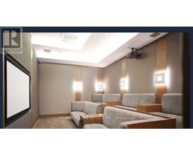 A well-lit room with a couch and a television.