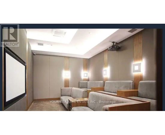 A well-lit room with a couch and a television.