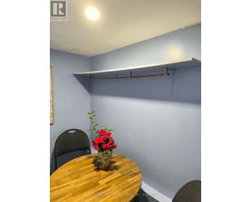 A table with a vase of flowers on it in a room.
