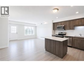 A spacious kitchen with a large island and modern appliances.