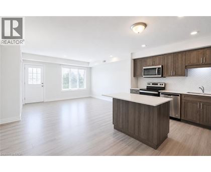 A spacious kitchen with a large island and modern appliances.