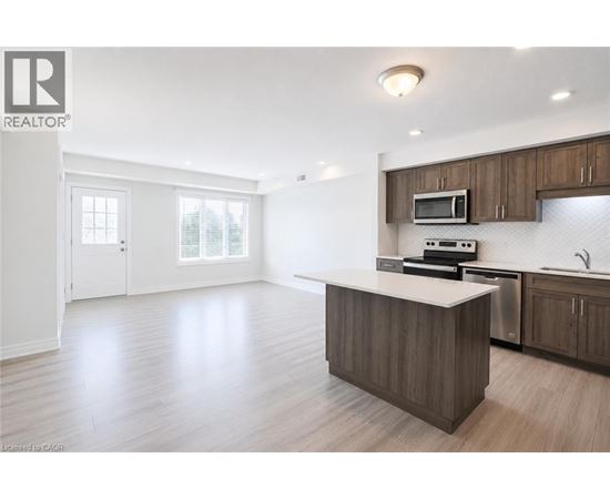 A spacious kitchen with a large island and modern appliances.