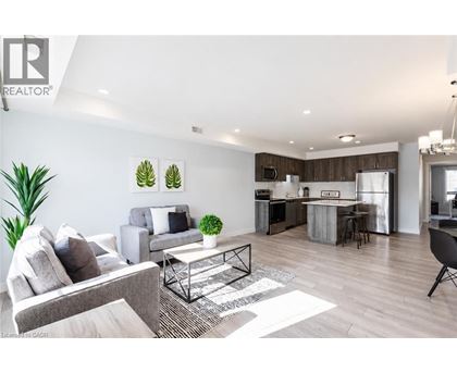 A modern living room with a grey couch and a coffee table.