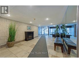 A spacious lobby with a fireplace and seating area.