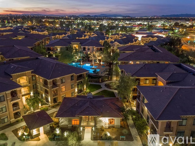 A large housing development with a swimming pool in the center.