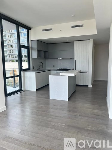 A modern kitchen with a large island in the middle.