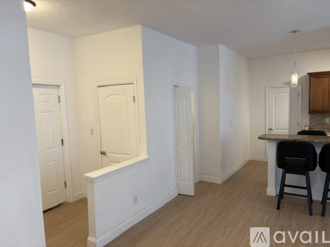 A small room with a desk and chairs.