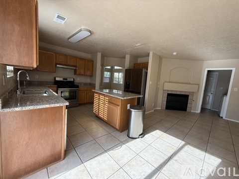 A kitchen with a counter top and a sink.