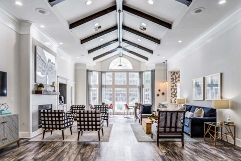A modern living room with a fireplace and a large window.