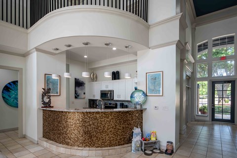 A reception area with a gold patterned counter.