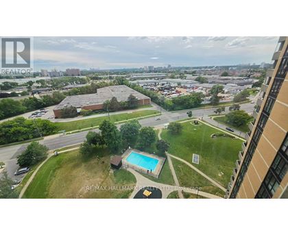 A view of a pool and a building from a high angle.