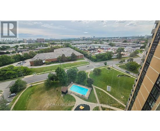 A view of a pool and a building from a high angle.