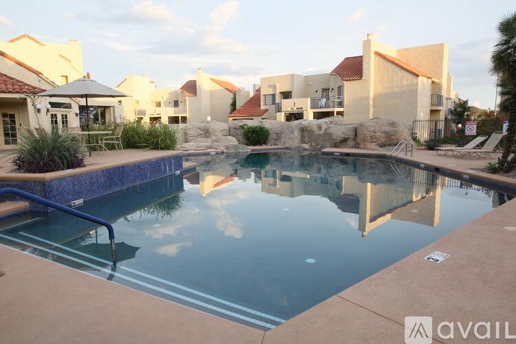 A swimming pool in front of a resort.