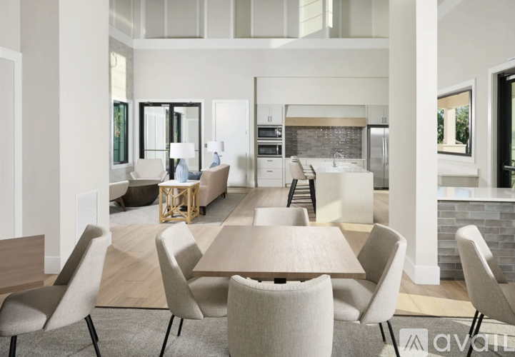 A modern dining room with a table set for six.