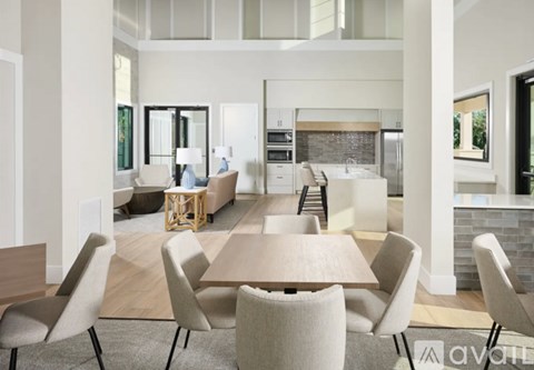 A modern dining room with a table set for six.