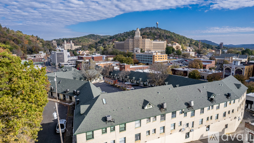 A cityscape with buildings and a clear sky.