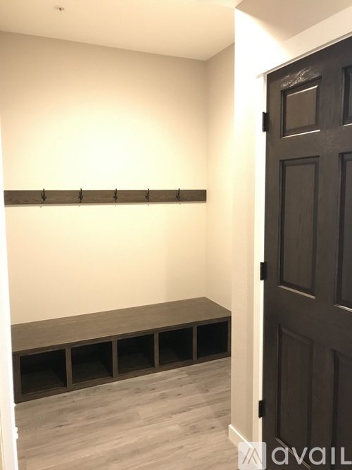 A black door is on the right side of the image.