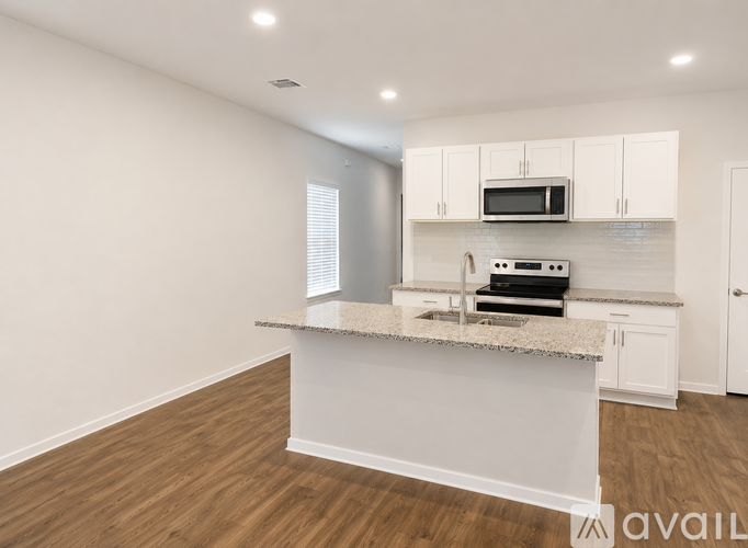A kitchen with a countertop and cabinets.
