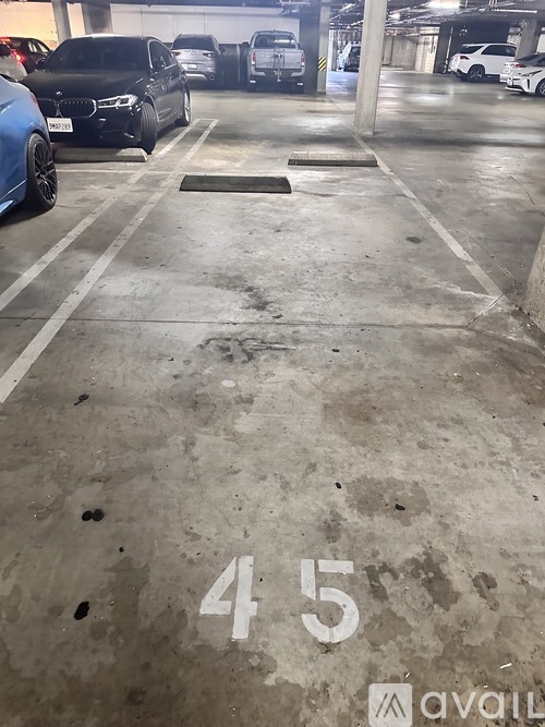 A parking garage with the number 45 painted on the ground.