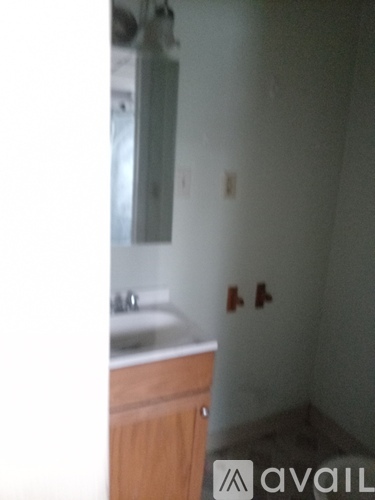 A bathroom with a sink and mirror.