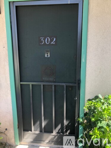 A door with the number 302 on it.