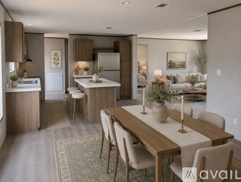 A modern kitchen with a dining table set for four.