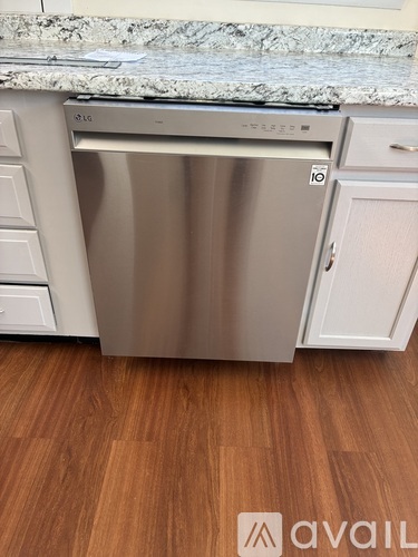 A dishwasher is built into a kitchen counter.