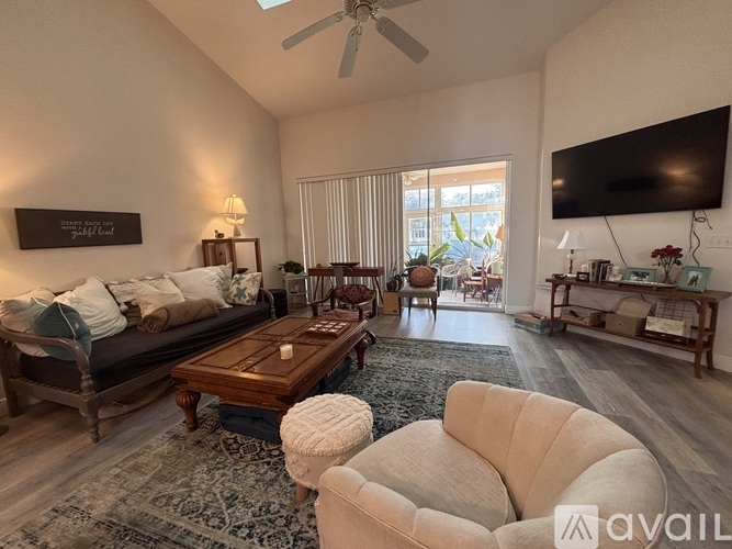 A living room with a couch, chair, and coffee table.