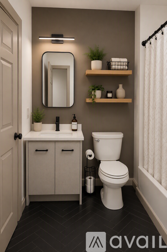 A bathroom with a toilet, sink, mirror, and shelves.
