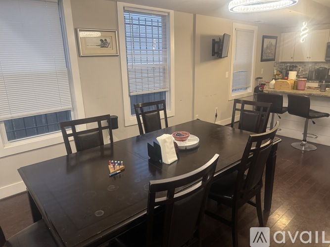 A dining room with a table set for two.