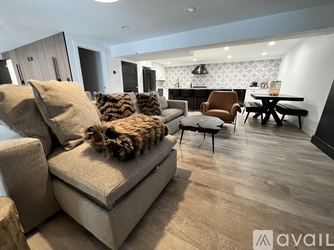 A living room with a couch and a chair.