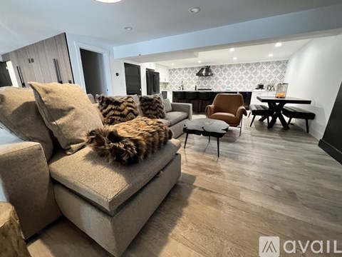 A living room with a couch and a chair.