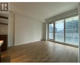 A spacious room with wooden floors and large windows at Keller Williams Realty Centres, Brokerage.