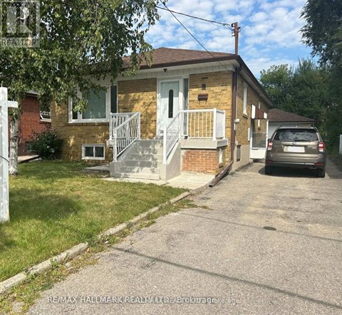 A small house with a car parked in front.