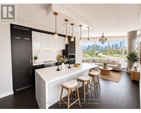 A modern kitchen with a large island and bar stools.