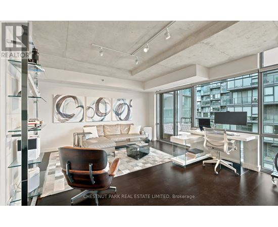 A modern office space with a large window overlooking the city.