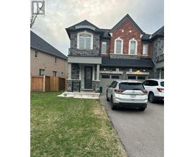 A house with a car parked in front.