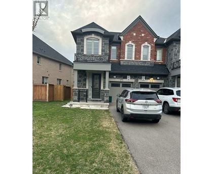 A house with a car parked in front.