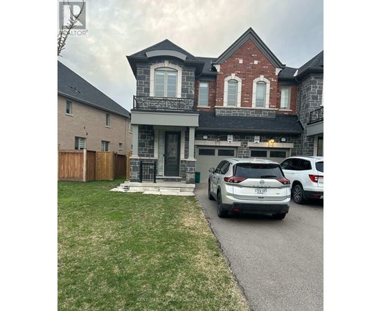 A house with a car parked in front.