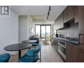 A modern kitchen with a dining table and chairs.