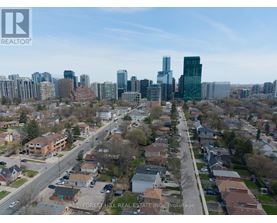 A cityscape with a mix of residential and commercial buildings.