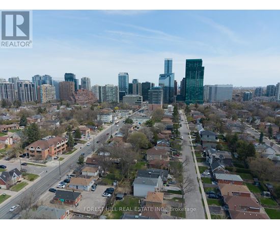 A cityscape with a mix of residential and commercial buildings.