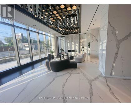 A spacious room with marble flooring and a ceiling lighting fixture.