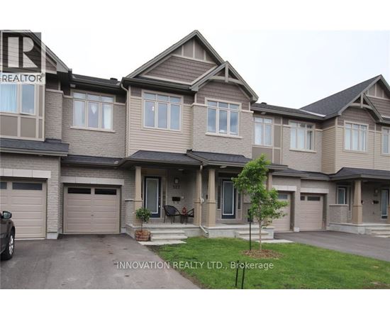 A house with a sign that says Innovation Realty LTD. Brokerage.