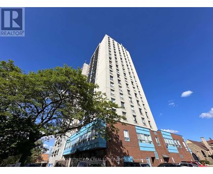 A tall building with a blue sky in the background.