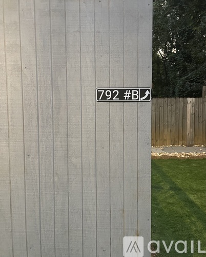 A sign on a fence post reads 792 #B.