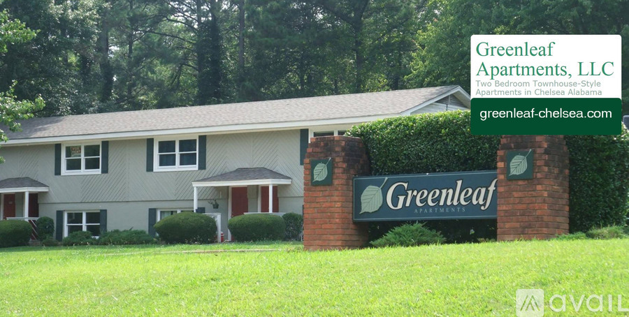 A sign for Greenleaf Apartments, LLC is displayed in front of a building.